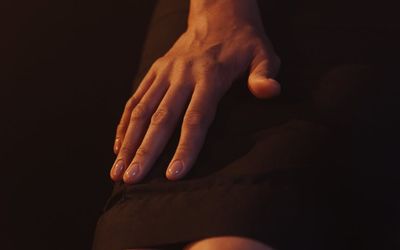 Silhouette balancing on one leg against a subtle background.